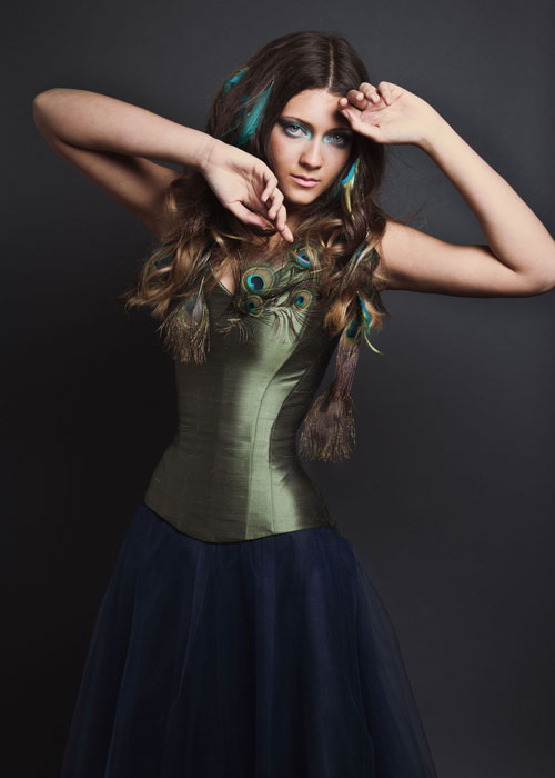 Green silk corset with peacock feather